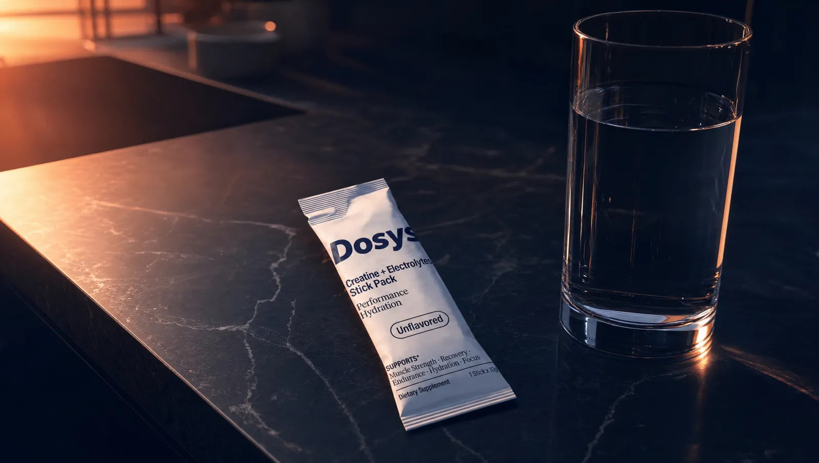 Dosys stick pack next to a glass of water on a kitchen counter at dawn